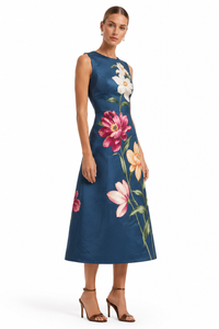 Side view of Leo Lin Cleo Embroidered Midi Dress in Indigo showcasing the tailored waist, elegant sleeveless design and colourful lily embroidery.