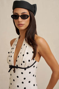 Close-up of raised velvet polka dots on the textured linen-blend fabric of the BY JOHNNY Florentina dress.