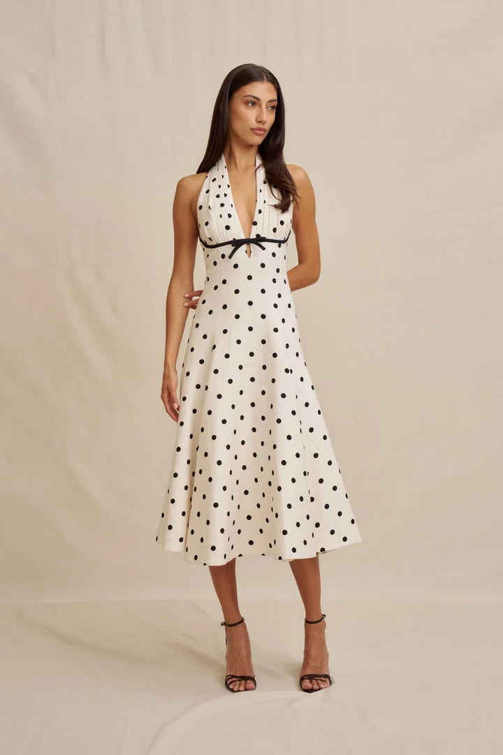 Model wearing the BY JOHNNY Florentina Polka Dot Halter Dress, showing the full silhouette and hemline.