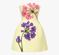 Leo Lin Roselle Appliqué Bustier Mini Dress in Agapanthus Print, featuring a pale yellow base, pink and purple floral embroidery and structured A-line skirt.