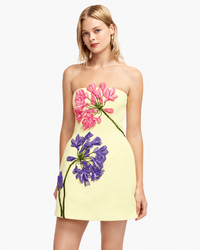Leo Lin Roselle Appliqué Bustier Mini Dress in sherbet yellow featuring pink and purple 3D agapanthus floral embroidery, strapless neckline and A-line silhouette.