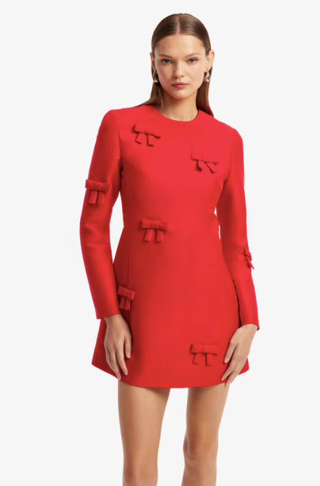 Close-up of the handcrafted bow embellishments on the LEO LIN Aliza Bow Long Sleeve Mini Dress, available for luxury designer dress hire.