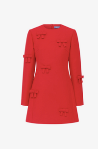 Three-quarter view of the LEO LIN Aliza Bow Long Sleeve Mini Dress in Vermilion available for designer dress hire in Melbourne and Australia-wide.